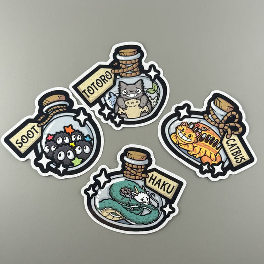 Set of four animated character stickers on a gray background
