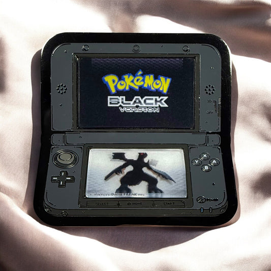 Nintendo DS with 'Pokémon Black' on the screen