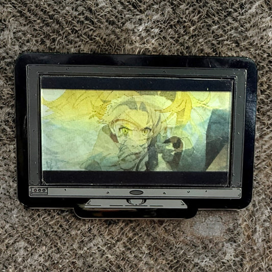Small screen displaying an animated character on a textured surface