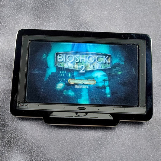 Portable device displaying 'BioShock Infinite' game title screen on a gray background