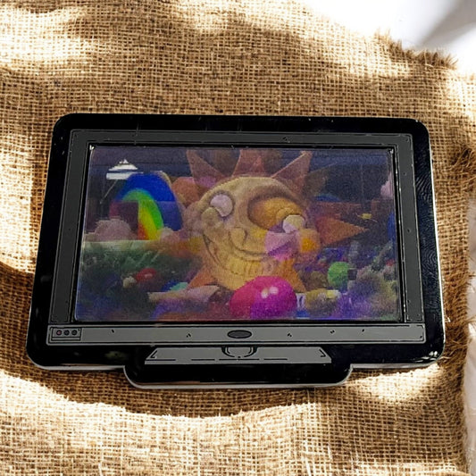 Small screen displaying a colorful cartoon character on a textured fabric background