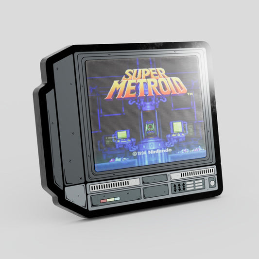 Vintage-style gaming console with 'Super Metroid' screen on a gray  Lenticular Enamel Pin background