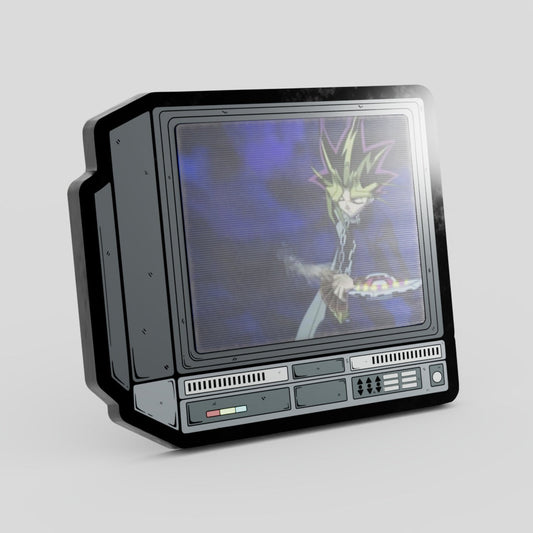 Vintage-style television set with a character on the screen against a gray background Yugioh Hard Enamel Lenticular Pin